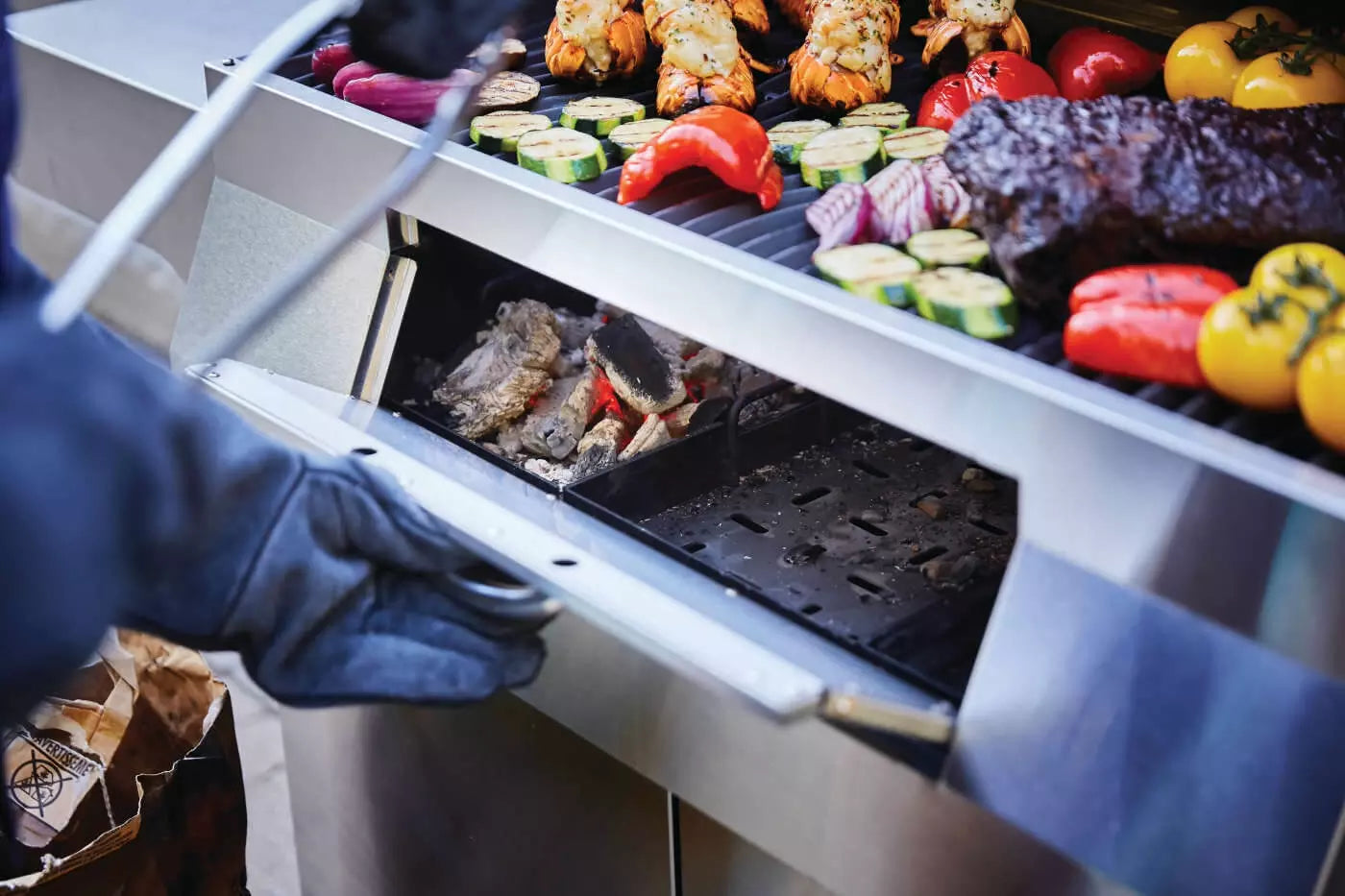 Napoleon Professional 605 Charcoal Grill's Front Loading Charcoal Access Door